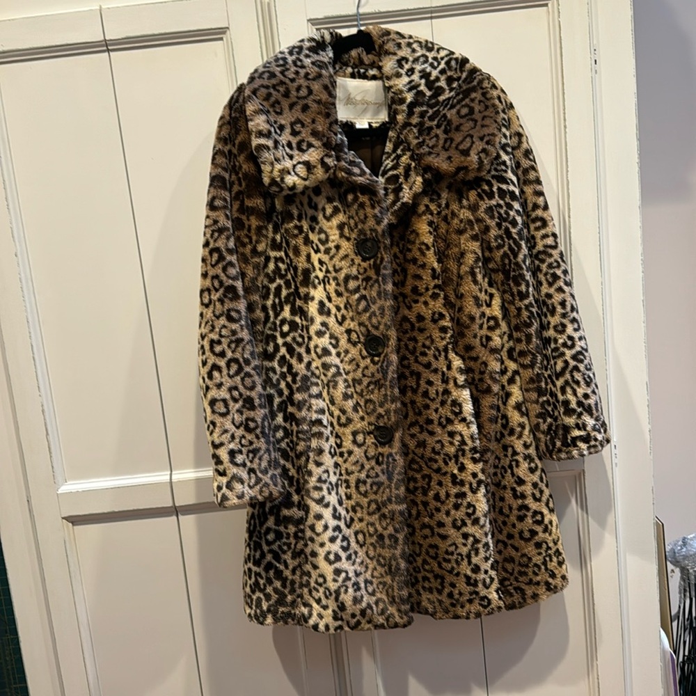 Faux Animal print coat. Excellent condition. Weatherproof design, size 8